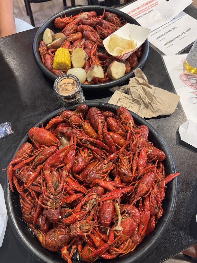 Indoor dining with seafood dishes and drinks.